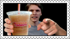 A stamp of Jerma985 holding up an iced coffee from Dunkin Donust and pointing at the camera while smiling.